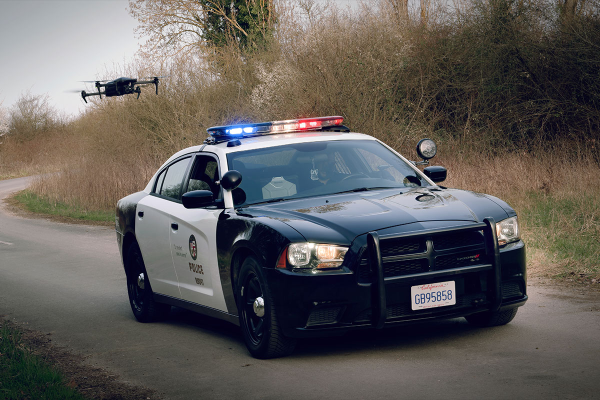 Police Car followed by quadcopter drone Parrot ANAFI UKR GOV